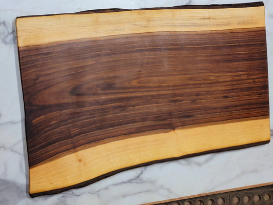Swooping Down- A live edge Black Walnut Grazing board